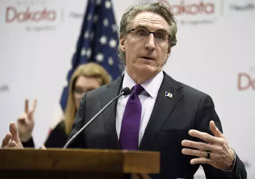 North Dakota Gov. Doug Burgum speaks at the state Capitol on April 10, 2020, in Bismarck, N.D. Teachers in North Dakota can still refer to transgender students by the personal pronouns they use, after lawmakers on Monday, April 3, 2023, failed to override the governor’s veto of a controversial bill to place restrictions on educators. (Mike McCleary/The Bismarck Tribune via AP, File)