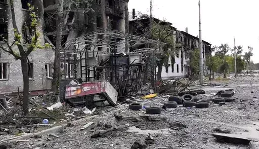 In this photo provided by the Luhansk region military administration, damaged residential buildings are seen in Lysychansk, Luhansk region, Ukraine, early Sunday, July 3, 2022. Russian forces pounded the city of Lysychansk and its surroundings in an all-out attempt to seize the last stronghold of resistance in eastern Ukraine's Luhansk province, the governor said Saturday. A presidential adviser said its fate would be decided within the next two days. (Luhansk region military administration via 
