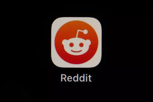 The Reddit app icon is seen on a smartphone, Feb. 28, 2023, in Marple Township, Pa. Reddit is due to begin trading on the New York Stock Exchange on Tuesday, March 21, 2024. (AP Photo/Matt Slocum, File)