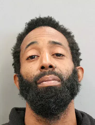 This booking photo provided by the Houston Police Department shows Tony Earls on Tuesday, Feb. 15, 2022. Houston police say Earls, who had been robbed at an ATM on Monday evening, Feb. 14, opened fire in an attempt to stop his attacker but instead shot a 9-year-old girl in a truck driving nearby. The girl later died at a hospital.  (Houston Police Department via AP)
