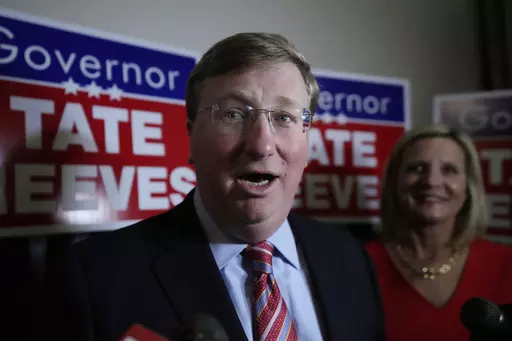 With wife Elee Reeves at his side, Mississippi Gov. Tate Reeves speaks in Jackson, Miss., after winning the Republican primary on Tuesday, Aug. 8, 2023. Records show Tate Reeves received a $10,000 campaign contribution from a shipping company executive in 2020, several days before the state announced incentives for a division of the company to expand its operation in Mississippi. (AP Photo/Rogelio V. Solis, File)