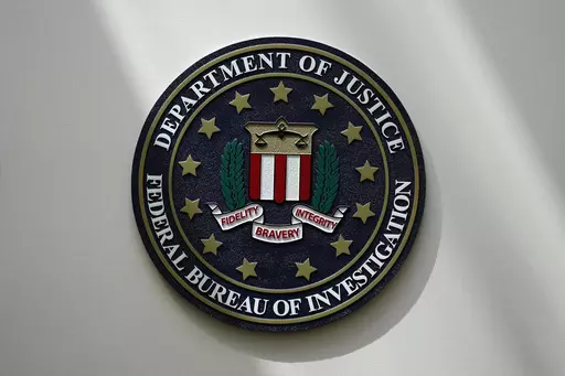 The FBI seal is pictured in Omaha, Neb., Aug. 10, 2022. A White House advisory board is calling for major changes in how the FBI uses a controversial foreign surveillance tool. The President’s Intelligence Advisory Board issued a report Monday, July 31, 2023, with new recommendations related to Section 702 of the Foreign Intelligence Surveillance Act. (AP Photo/Charlie Neibergall, File)