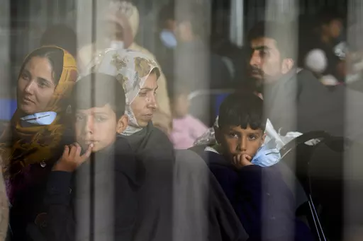 Evacuees from Afghanistan wait with other evacuees to fly to the United States or another safe location in a makeshift departure gate inside a hanger at the United States Air Base in Ramstein, Germany, Sept. 1, 2021. The Afghan man who speaks only Farsi represented himself in U.S. immigration court, and the judge denied him asylum. The Associated Press obtained a transcript of the hearing that offers a rare look inside an opaque and overwhelmed immigration court system where hearings are closed 