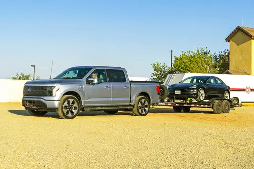 This photo provided by Edmunds shows the 2022 Ford Lightning electric pickup truck. It is capable of towing up to 10,000 pounds, though towing will significantly affect its range. ( Rex Tokeshi-Torres/Courtesy of Edmunds via AP)