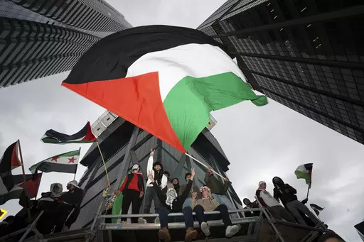 Supporters wave the Palestine flag at a march in Toronto, on Oct. 9, 2023. Before it transformed into X, Twitter was the place to turn to for live and reliable information about big news events, from wars to natural disasters. But as the Israel-Hamas war has underscored, that is no longer the case. (Arlyn McAdorey/The Canadian Press via AP, File)