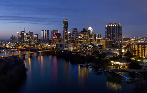Lights from inside buildings illuminate the skyline, Monday, Feb. 5, 2018, in Austin, Texas. Some of the largest U.S. cities challenging their 2020 census numbers aren't getting the results they hoped for from the U.S. Census Bureau. (Jay Janner/Austin American-Statesman via AP, File)