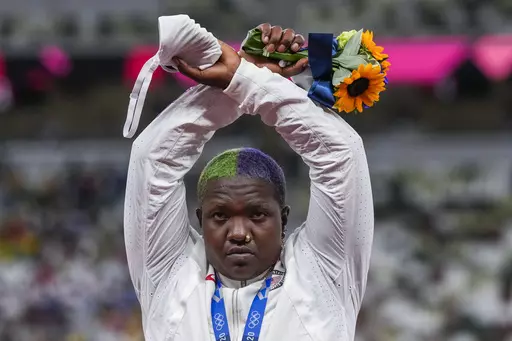 Raven Saunders, of the United States, poses with her silver medal in women's shot put at the 2020 Summer Olympics, Sunday, Aug. 1, 2021, in Tokyo, Japan. Saunders, the silver-medal shot putter who used her platform at the Tokyo Olympics to bring attention to social injustice, has been suspended for 18 months for failing to show up for doping tests. The U.S. Anti-Doping Agency announced the sanction Wednesday, March 15, 2023, for the 26-year-old, saying she had committed three “whereabouts fail