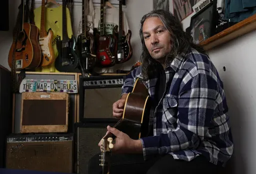 Adam Granduciel, leader of the band The War on Drugs, poses for a portrait at his studio on Monday, Aug. 26, 2024, in Burbank, Calif. (AP Photo/Chris Pizzello)