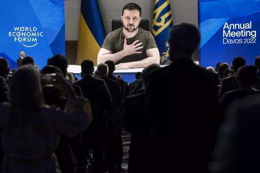 Ukrainian President Volodymyr Zelenskyy addresses by videolink the opening plenary session hosted by Klaus Schwab, Founder and Executive Chairman, World Economic Forum, left, during the 51st annual meeting of the World Economic Forum, WEF, in Davos, Switzerland, on Monday, May 23, 2022. As Russia’s invasion of Ukraine grinds into its fourth month, officials in Kyiv have expressed fears that the specter of “war fatigue” could erode the West’s resolve in helping the country push back Mosco