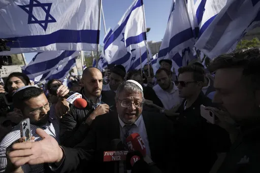 Israeli lawmaker Itamar Ben-Gvir, center, speaks to the media surrounded by right wing activists as they gather for a march in Jerusalem, April 20, 2022. Ben-Gvir visited Jerusalem’s most sensitive holy site Thursday, July 18, 2024, a move that could threaten the delicate Gaza cease-fire talks. (AP Photo/Ariel Schalit, File)