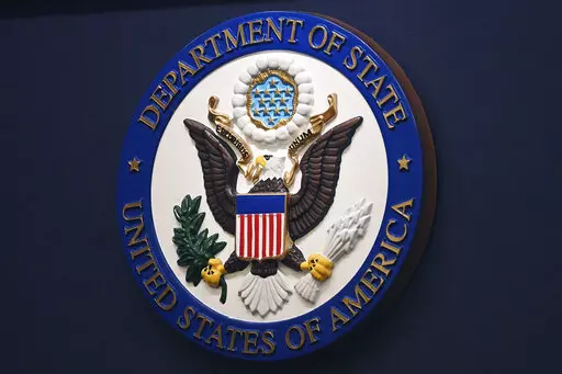 The State Department seal is seen on the briefing room lectern at the State Department in Washington, Jan. 31, 2022. Everyday Americans will be able to help refugees adjust to life in the U.S. in a program being launched by the State Department. The goal is to give private citizens a role in resettling the thousands of refugees who come to America every year. The State Department is calling the new program the Welcome Corps.(Mandel Ngan, Pool via AP, File)