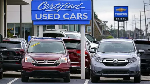 Used car are on display on a lot in Wexford, Pa., Thursday, Sept. 29, 2022. The Commerce Department releases its revised estimate of how the U.S. economy fared in the fourth quarter on Thursday, Feb. 23, 2023. (AP Photo/Gene J. Puskar, File)