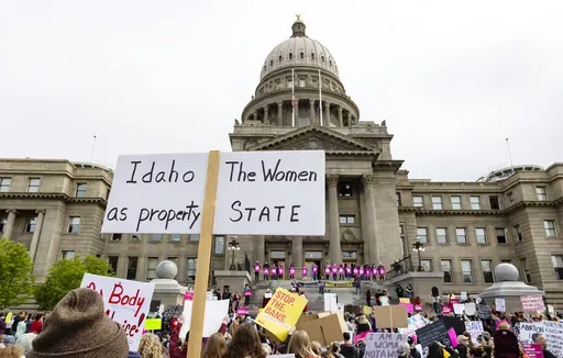 An attendee at Planned Parenthood's Bans Off Our Bodies rally for abortion rights holds a sign reading outside of the Idaho Statehouse in downtown Boise, Idaho, on May 14, 2022. (Sarah A. Miller/Idaho Statesman via AP, File)