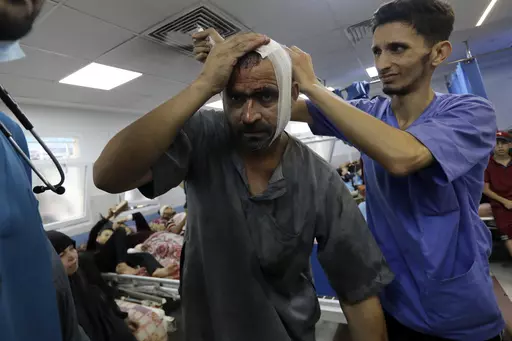 An injured Palestinian man receives treatment at the al-Shifa hospital, following Israeli airstrikes on Gaza City, central Gaza Strip, Sunday, Nov. 5, 2023. Gaza's Shifa Hospital has become the focus of a days-long stalemate in Israel's war against Hamas. Israel claims Hamas uses the facility for military purposes and has built a vast underground command center below the hospital. Since Israel declared war against Hamas, its forces have moved in on Shifa. But hundreds of doctors and patients rem