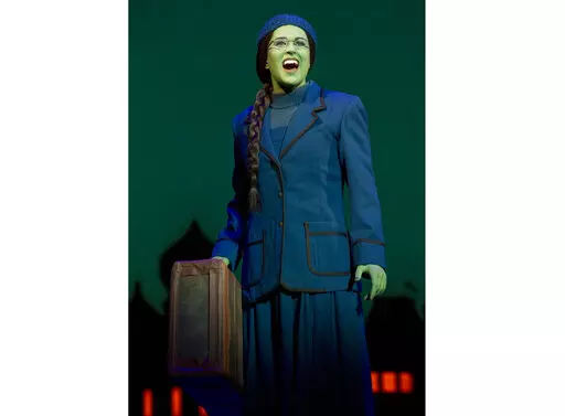 This image released by Polk & Co. shows understudy Carla Stickler in the role of Elphaba from the musical "Wicked" in New York in March 2012. Stickler, who had left show business and became a software engineer in Chicago, returned to New York to star as the green-skinned Elphaba when the cast was ravaged by illness. (Joan Marcus/Polk & Co. via AP)