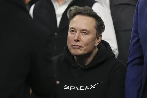 Elon Musk attends the finals at the NCAA wrestling championship, Saturday, March 22, 2025, in Philadelphia. (AP Photo/Matt Rourke)