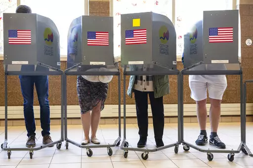 People cast their ballots at Coit Arts Academy in Grand Rapids on Tuesday, Nov. 8, 2022. (Joel Bissell/The Grand Rapids Press via AP)
