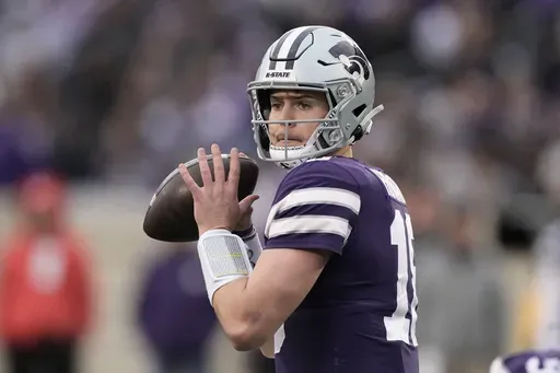 Then-0Kansas State quarterback Will Howard looks to pass during the second half of the team's NCAA college football game against Baylor, Nov. 11, 2023, in Manhattan, Kan. (AP Photo/Charlie Riedel, File)
