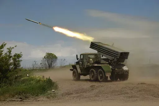 A Donetsk People's Republic militia's multiple rocket launcher fires from its position not far from Panteleimonivka, in territory under the government of the Donetsk People's Republic, eastern Ukraine, Saturday, May 28, 2022. Day after day, Russia is pounding the Donbas region of Ukraine with relentless artillery and air raids, making slow but steady progress to seize the industrial heartland of its neighbor. With the conflict now in its fourth month, it’s a high-stakes campaign that could dic