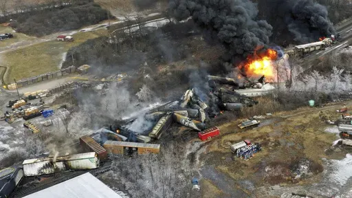 In this photo taken with a drone, portions of a Norfolk Southern freight train that derailed the previous night in East Palestine, Ohio, remain on fire at mid-day, Feb. 4, 2023. (AP Photo/Gene J. Puskar, File)