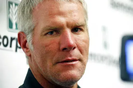 Former NFL quarterback Brett Favre speaks with reporters prior to his induction to the Mississippi Hall of Fame in Jackson, Miss., Saturday, Aug. 1, 2015. Favre has filed lawsuits accusing the Mississippi state auditor and two national sportscasters of defaming him in public discussions about the misspending of welfare money. (AP Photo/Rogelio V. Solis, File)