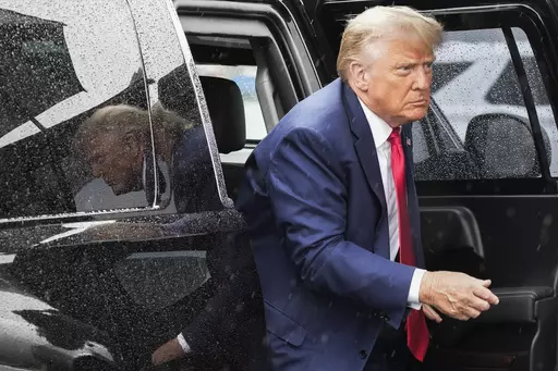 Former President Donald Trump arrives to board his plane at Ronald Reagan Washington National Airport, Aug. 3, 2023, in Arlington, Va., after facing a judge on federal conspiracy charges that allege he conspired to subvert the 2020 election. Trump and his legal team face long odds in their bid to move his 2020 election conspiracy trial out of Washington. They argue the Republican former president can’t possibly get a fair trial in the overwhelmingly Democratic nation’s capital. (AP Photo/Ale