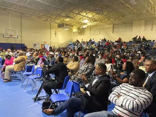 Hundreds of people wait to see a screening of the movie "Till" at John F. Kennedy High School in Mound Bayou, Miss., on Thursday, Oct. 27, 2022. The feature film is going into wide release across the U.S. this weekend after being in limited release since Oct. 14.(AP Photo/Emily Wagster Pettus)