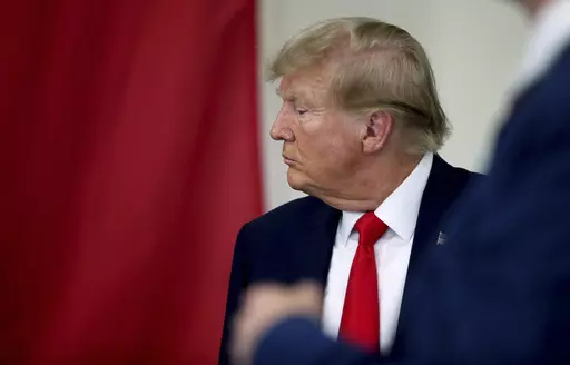 Republican presidential candidate and former President Donald Trump speaks to Texas state troopers and guardsmen at the South Texas International Airport, Sunday, Nov. 19, 2023, in Edinburg, Texas. (Delcia Lopez/The Monitor via AP, Pool)