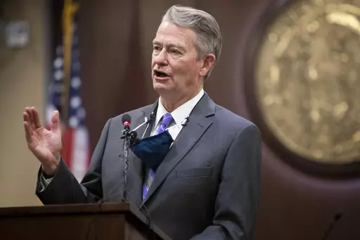 Idaho Gov. Brad Little gestures during a press conference at the Statehouse in Boise, Idaho, on Oc. 1, 2020. Little has signed a bill criminalizing gender-affirming medical care for transgender youth on Tuesday, April 4, 2023. (Darin Oswald/Idaho Statesman via AP, File)