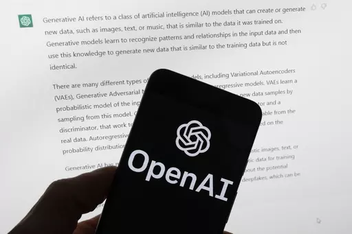 The OpenAI logo is seen on a mobile phone in front of a computer screen displaying output from ChatGPT, March 21, 2023, in Boston. As state lawmakers rush to get a handle on fast-evolving artificial intelligence technology, they're often focusing first on their own state governments before imposing restrictions on the private sector. Legislators are seeking ways to protect constituents from discrimination and other harms while not hindering cutting-edge advancements in medicine, science, busines