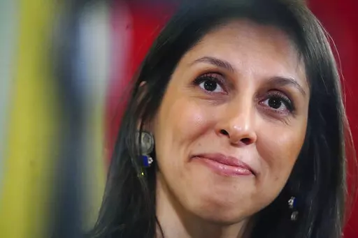 Nazanin Zaghari-Ratcliffe smiles during a press conference hosted by her local MP Tulip Siddiq, in the Macmillan Room, Portcullis House, following her release from detention in Iran, in London, Monday March 21, 2022. (Victoria Jones/Pool Photo via AP)