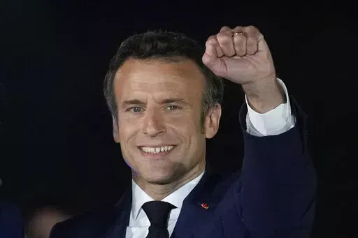 French President Emmanuel Macron celebrates with his supporters in Paris, France, Sunday, April 24, 2022. French President Emmanuel Macron's reelection has bolstered his standing as a senior player in Europe. Macron is now expected to push for strengthening the 27-nation bloc and throw all his weight behind efforts to end the war in Ukraine. (AP Photo/Christophe Ena, File)
