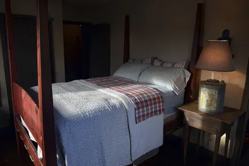 A shaft of light shines into a bedroom in Belle, W.Va., on Nov. 11, 2013. (Craig Cunningham/The Daily Mail via AP, File)