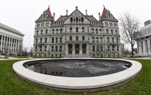 The New York state Capitol in Albany, N.Y., is pictured on Dec. 14, 2020. New York's minimum-wage workers had more than just the new year to celebrate Monday, Jan. 1, 2024, with a pay bump kicking in as the clock ticked over to 2024. In the first of a series of annual increases slated for the Empire State, the minimum wage increased to $16 in New York City and some of its suburbs, up from $15. In the rest of the state, the new minimum wage is $15, up from $14.20. (AP Photo/Hans Pennink, File)