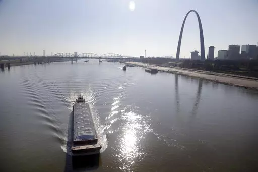A barge powers its way up the Mississippi River on Nov. 16, 2012, in St. Louis. Parts of the Mississippi River are so low from weeks of drought that barge traffic is being limited at the worst possible time: as crop harvests begin in 2022. (AP Photo/Jeff Roberson, File)