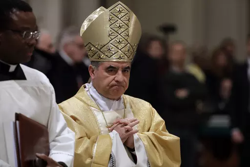 Mons. Giovanni Angelo Becciu presides over an eucharistic liturgy, at the St. John in Latheran Basilica, in Rome, Thursday, Feb. 9, 2017. The Vatican's chief prosecutor has appealed a court verdict that, while finding a cardinal guilty of embezzlement, largely dismantled his theory of a grand conspiracy to defraud the Holy See of millions of euros.(AP Photo/Gregorio Borgia, File )