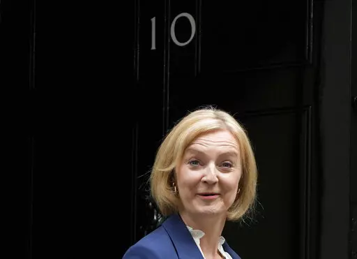 British Prime Minister Liz Truss leaves 10 Downing Street to attend her first Prime Minister's Questions at the Houses of Parliament, in London, Wednesday, Sept. 7, 2022. (AP Photo/Frank Augstein)