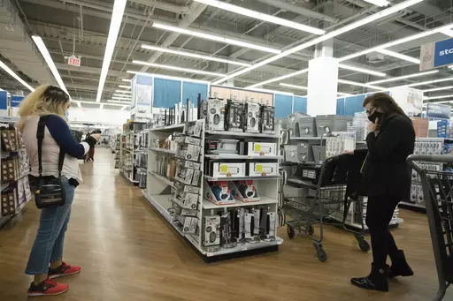 In this March 25, 2021 file photo, shoppers browse in New York. Women often pay more for goods and services, but it doesn’t have to be that way. Shopping experts say that by opting for gender-neutral personal care products, consumers can sometimes avoid what’s been dubbed the “pink tax.” (AP Photo/Mark Lennihan, File)