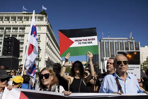 Pro-Palestinian protesters take part in a rally to express solidarity with Palestinians, in front of the parliament, in Athens, Greece, Sunday, Nov. 5, 2023. The Jordan River is a winding, 200-plus-mile run to the east of Israel and the West Bank. The sea is the glittering Mediterranean to its west. But a phrase about the space in-between, “from the river to the sea,” has become a battle cry with new power to roil Jews and pro-Palestinian activists in the aftermath of Hamas’ murderous ramp