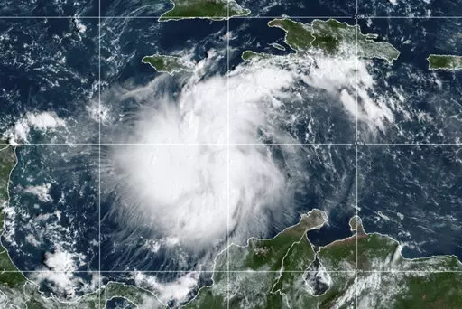 This satellite image provided by the National Oceanic and Atmospheric Administration shows Tropical Storm Ian over the central Caribbean on Saturday, Sept. 24, 2022.  (NOAA via AP)