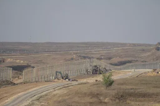 Israeli army bulldozers are seen near the Gaza Strip border, in southern Israel, Thursday, June 13, 2024. Israel's military said Saturday, June 15, that eight soldiers were killed in southern Gaza in the deadliest attack on Israeli forces in months. (AP Photo/Ohad Zwigenberg, File)