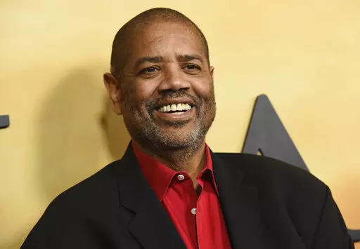 Gregory Allen Howard arrives at the Los Angeles premiere of "Harriet" on Oct. 29, 2019. Howard, who skillfully adapted stories of historical Black figures in “Remember the Titans” starring Denzel Washington, “Ali” with Will Smith and “Harriet” with Cynthia Erivo, died Friday at a hospital in Miami of heart failure, according to publicist Jeff Sanderson. He was 70. (Photo by Chris Pizzello/Invision/AP, File)