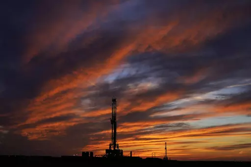 Oil drilling rigs are pictured at sunset, Monday, March 7, 2022, in El Reno, Okla. On Friday, May 5, The Associated Press reported on stories circulating online incorrectly claiming the planet has an unlimited supply of oil. (AP Photo/Sue Ogrocki, File)
