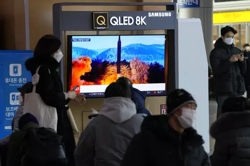 People watch a TV showing an image of North Korea's missile launch during a news program at the Seoul Railway Station in Seoul, South Korea, Monday, Jan. 31, 2022. North Korea confirmed Monday it test-launched an intermediate-range ballistic missile capable of reaching the U.S. territory of Guam, the North's most significant weapon launch in years, as Washington plans to respond to demonstrate it's committed to its allies' security in the region. (AP Photo/Ahn Young-joon)