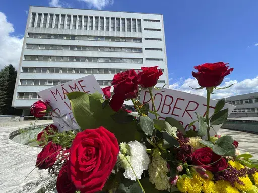Flowers are placed outside the F. D. Roosevelt University Hospital, where Slovak Prime Minister Robert Fico, who was shot and injured, is being treated, in Banska Bystrica, central Slovakia, Saturday, May 18, 2024. The man accused of attempting to assassinate Slovak Prime Minister Robert Fico made his first court appearance Saturday as the nation's leader remained in serious condition recovering from surgery after surviving multiple gunshots, Slovak state media said. (AP Photo/Lefteris Pitarakis