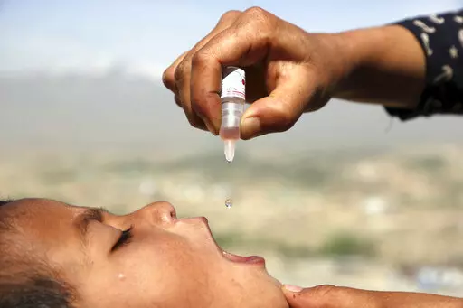 An Afghan health worker uses an oral polio vaccine on a child as part of a campaign to eliminate polio, on the outskirts of Kabul, Afghanistan, April 18, 2017. For years, global health officials have used billions of drops of an oral vaccine in a remarkably effective campaign aimed at wiping out polio in its last remaining strongholds — typically, poor, politically unstable corners of the world. Now, in a surprising twist in the decades-long effort to eradicate the virus, authorities in Jerusa