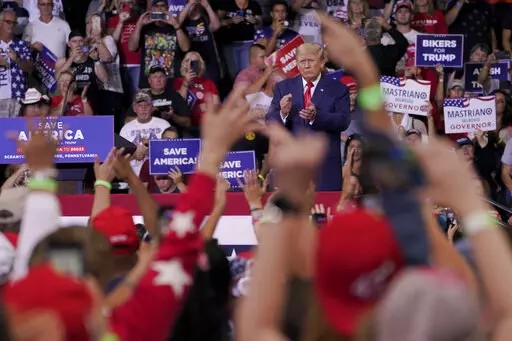 Former President Donald Trump speaks at a rally in Wilkes-Barre, Pa., Sept. 3, 2022. Trump is increasingly embracing and endorsing the QAnon conspiracy theory, even as the number of frightening real-world incidents linked to the movement increase.(AP Photo/Mary Altaffer, File)