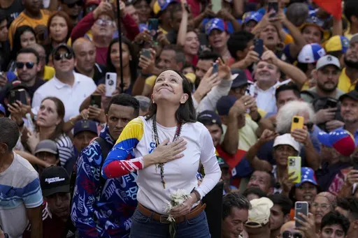 Venezuelan opposition leader Maria Corina Machado addresses supporters at a protest against President Nicolas Maduro in Caracas, Venezuela, Thursday, Jan. 9, 2025, the day before his inauguration for a third term. (AP Photo/Ariana Cubillos)