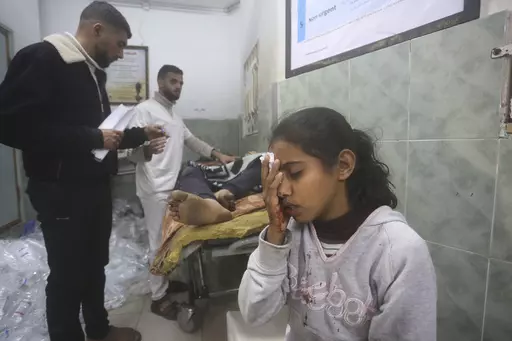 Palestinians wounded in Israeli bombardment receive treatment in a hospital t in Rafah, Gaza Strip, Monday, Feb. 5, 2024. (AP Photo/Hatem Ali)