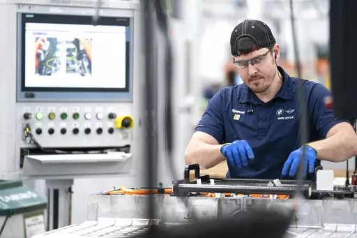 An employee works in the battery assembly hall at the BMW Spartanburg plant in Greer, S.C., Wednesday, October 19, 2022. On Thursday, the Commerce Department issues its first of three estimates of how the U.S. economy performed in the fourth quarter of 2022.(AP Photo/Sean Rayford, File)